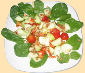 cherry tomatoes, spinach and sunflower seeds salad